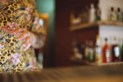 Rear view of woman with cat