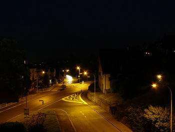 Illuminated street lights at night