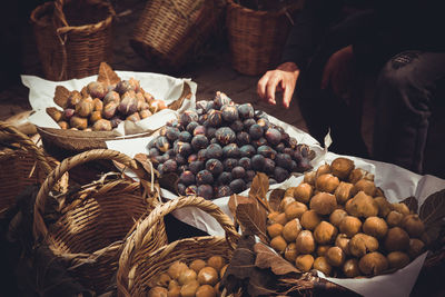 Various fruits in basket for sale at market stall