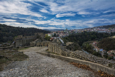 High angle view of buildings in town against sky