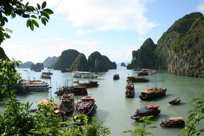 Boats in halong bay against sky