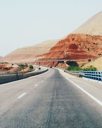 Curved country road along mountains