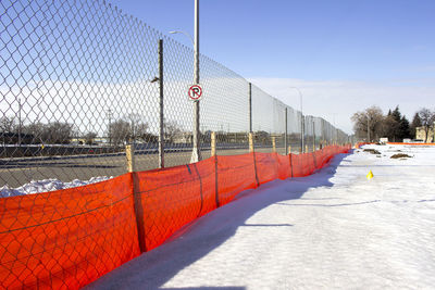 Chainlink fence on snowy field