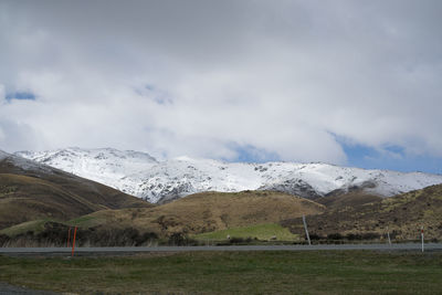 New zealand scenic view with snowcapped mountain at the end of winter season.