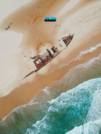 Aerial view of shipwreck on shore at beach