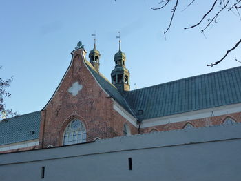 Low angle view of building against blue sky