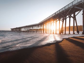 Scenic view of beach against clear sky