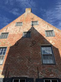Low angle view of old building against sky