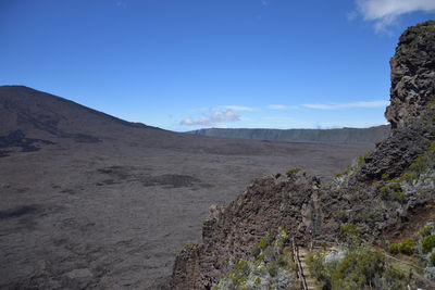 Scenic view of arid landscape against sky