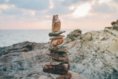 Close-up of stack of rock on beach