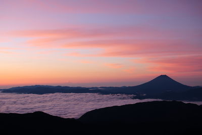 Scenic view of mt fuji and clouds during sunrise