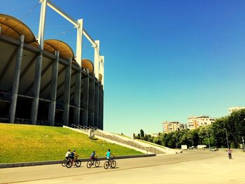 Person riding bicycle in parking lot