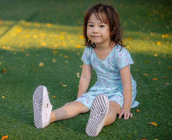 Portrait of cute girl on field