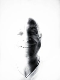 Portrait of smiling man against white background