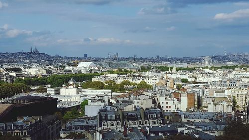 Aerial view of cityscape against sky