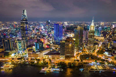 High angle view of illuminated city buildings at night