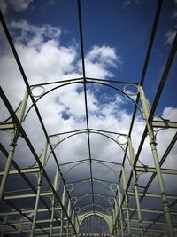 Low angle view of building against cloudy sky