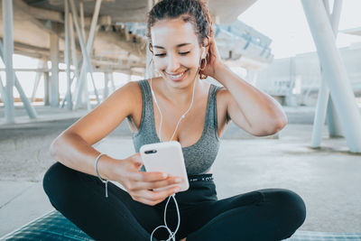 Young woman using mobile phone