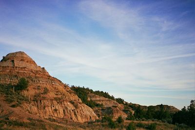 Scenic view of mountains against blue sky