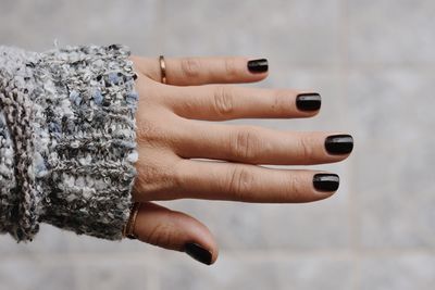 Close-up of woman hand holding cigarette