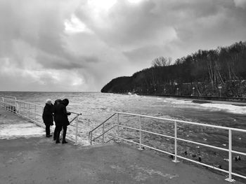 Scenic view of sea against cloudy sky