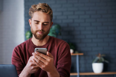 Young man using mobile phone