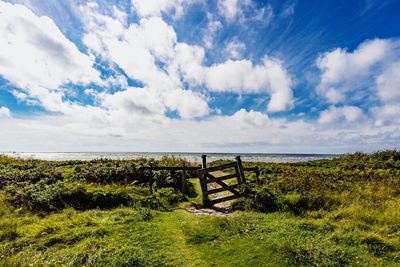 Scenic view of sea against cloudy sky