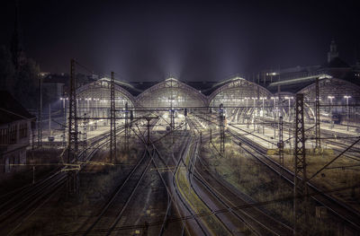 Metal structure against sky at night