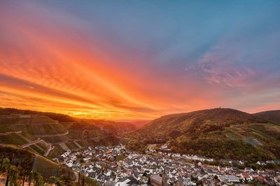 Panoramic shot of townscape against sky during sunset