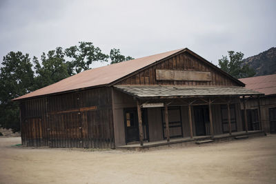 Exterior of house on field against sky