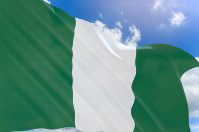 Low angle view of nigerian flag against sky