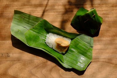 High angle view of green leaves on table