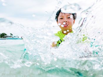 Boy playing in water