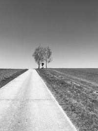 Rear view of  a road against clear sky