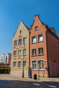 Low angle view of building against blue sky