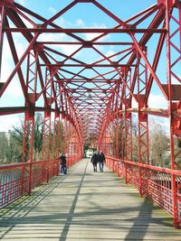 People walking on footbridge