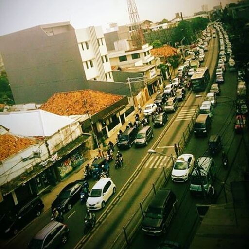 transportation, car, land vehicle, building exterior, architecture, built structure, mode of transport, high angle view, city, street, road, traffic, city life, vehicle, outdoors, day, diminishing perspective, parking, residential building, travel