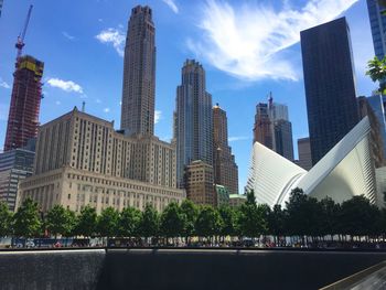 Modern buildings in city against sky