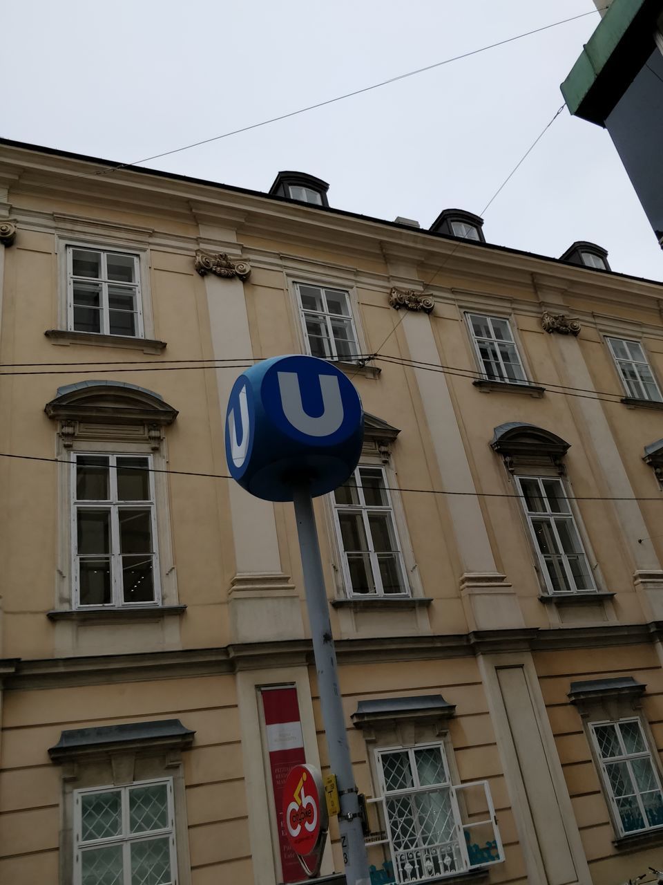 LOW ANGLE VIEW OF TEXT ON BUILDING