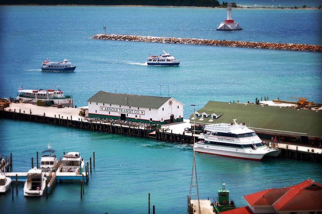 SAILBOATS MOORED AT HARBOR