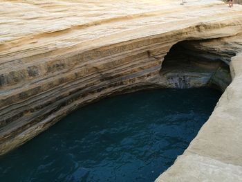 Scenic view of rock formations in water