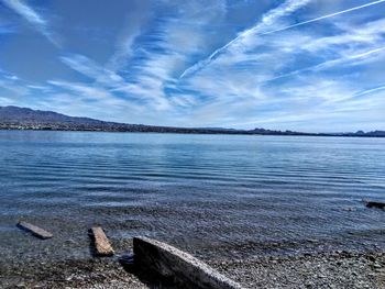 Scenic view of sea against blue sky