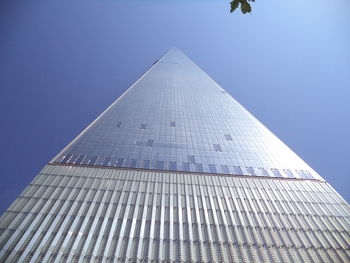 Low angle view of skyscrapers against clear sky - one world 