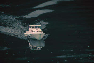 High angle view of sign floating on lake