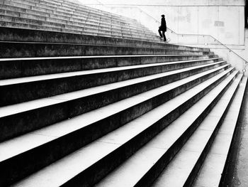 Woman moving up on staircase