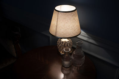 View of an illuminated lamp on the desk