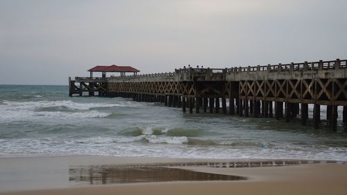 Pier over sea against sky