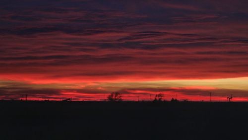 Scenic view of silhouette landscape against sky during sunset