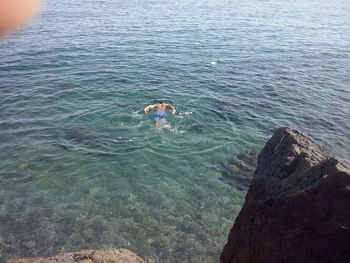 High angle view of person swimming in sea