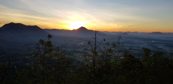 Scenic view of mountains against sky during sunset